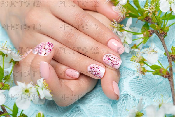 Spring manicure for the bride in gentle tones with flowers. Nail Design