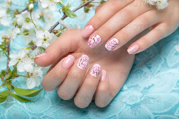 Spring manicure for the bride in gentle tones with flowers. Nail Design