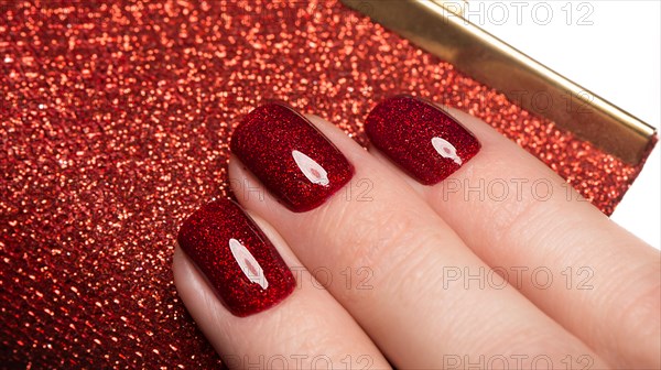 Bright festive red manicure on female hands. Nails design