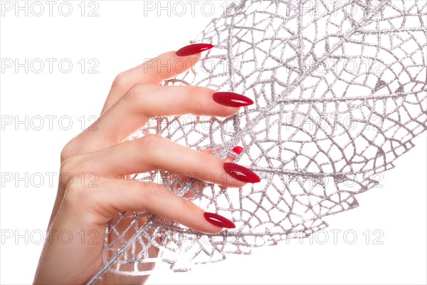 Bright festive red manicure on female hands. Nails design
