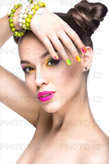 Beautiful girl in pink sunglasses with bright makeup and colorful nails. Beauty face. Picture taken in the studio on a white background