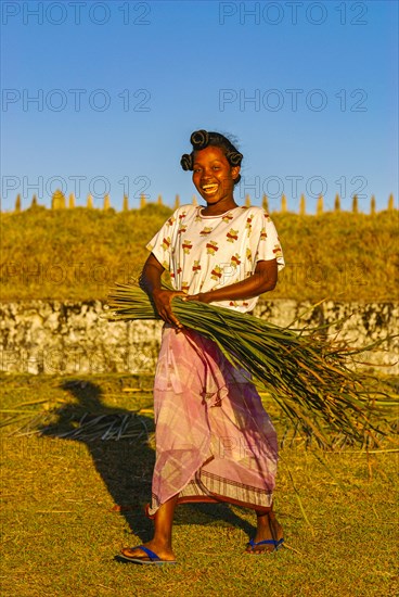 Friendly young woman with red in her hands