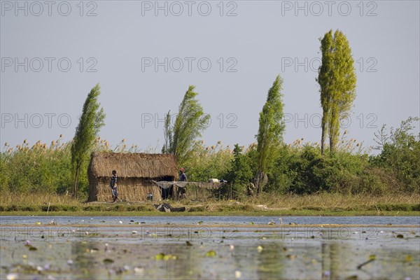 Local family with their hut