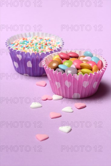 Chocolate lentils and love beads in paper moulds