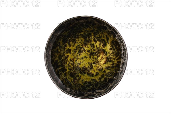 Top view of forged saucer with olive oil