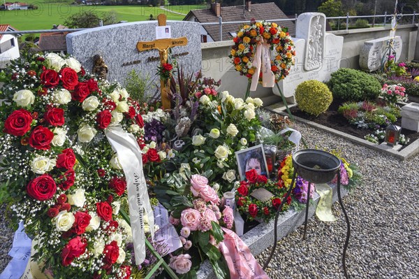 Fresh graves with flower decorations