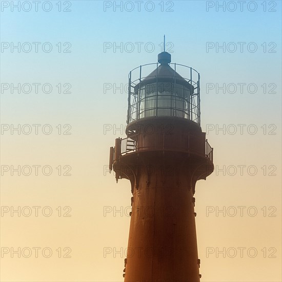 Red lighthouse in the haze