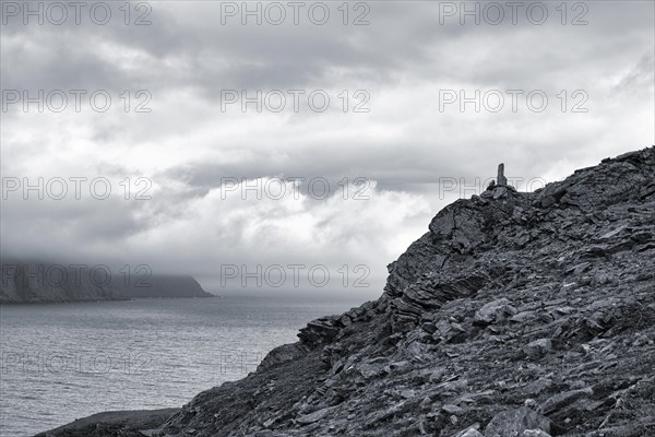 Rocky coast near Skarsvag with view to the North Cape