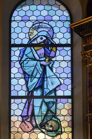 Coloured stained glass window with St. Magdalene in the Church of Our Lady Mariae Namen