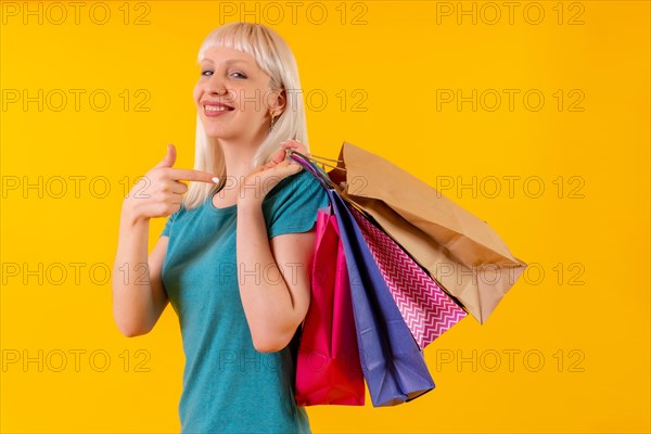 Pointing to shopping bags on sale