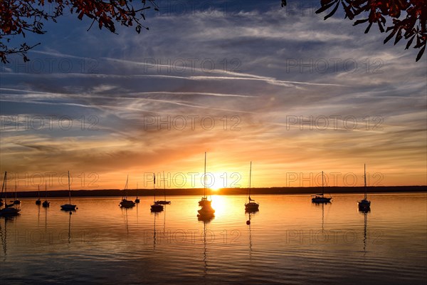 Sailing boats in the sunset in Herrschinger Bucht on Lake Lake Ammer