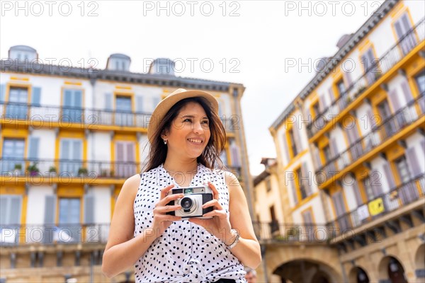 Tourist woman enjoying visiting the city looking at travel photos