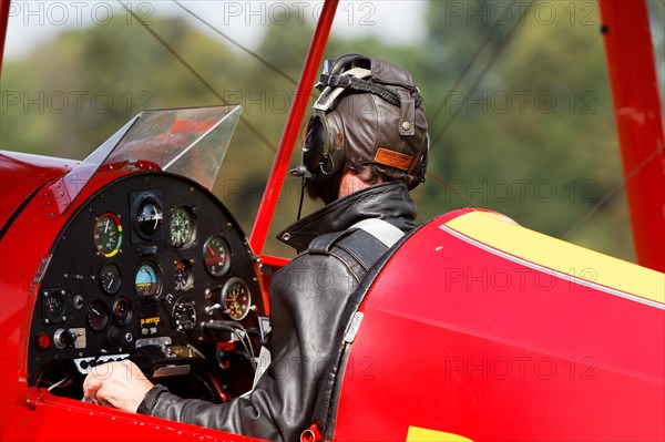 Pilot in his biplane