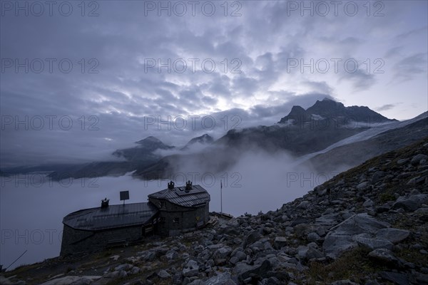 Chamanna Coaz mountain hut above the Val Rosegg valley at blue hour