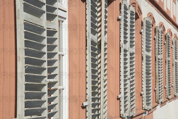 A row of shutters with louvres