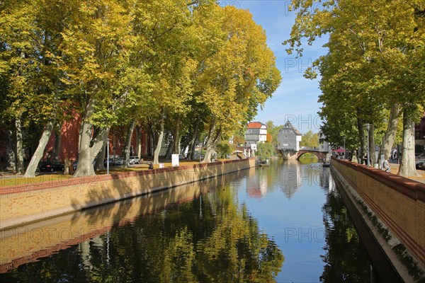 River Nahe with avenue during autumn and view of bridge houses