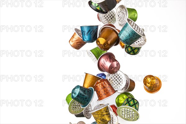 Different coloured used coffee capsules