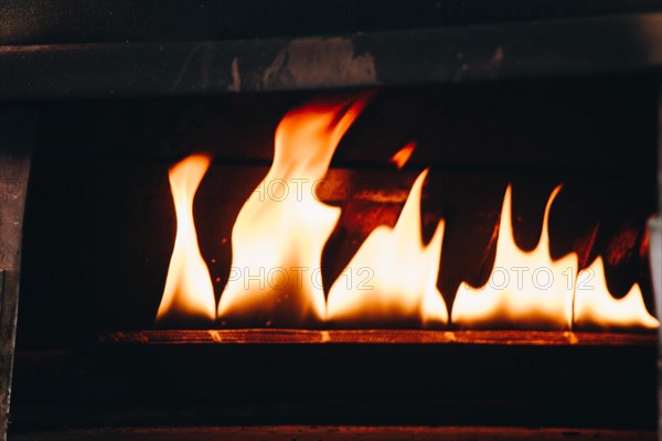 The yellow flames in a stone oven in display
