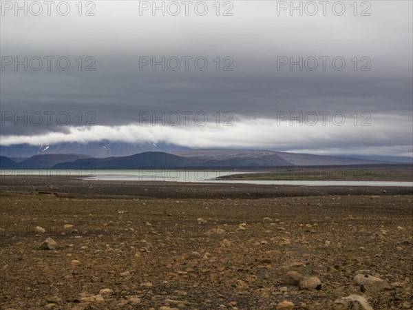 Glacial lake and barren volcanic landscape
