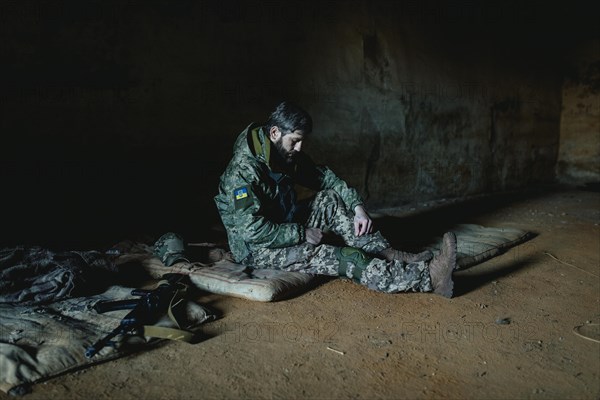 Soldier on his sleeping pad in his units accommodation