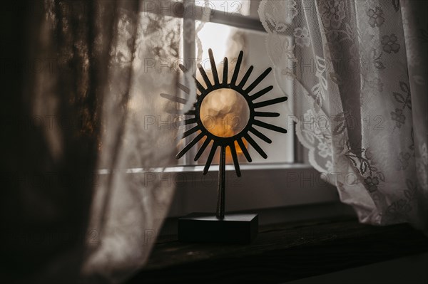 Decoration element at sunrise on the window sill