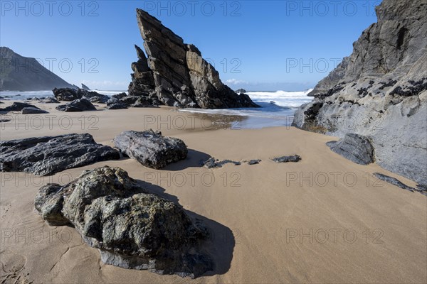 Rocky coast and sandy beach at Praia da Adraga