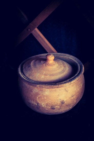 Ancient metal jug in oriental style in view