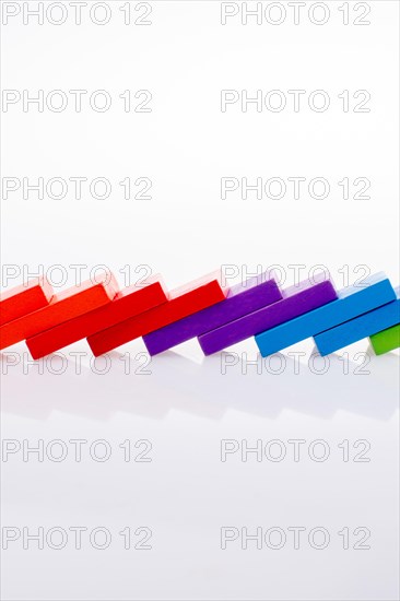 Colorful Domino Blocks in a line on a white background