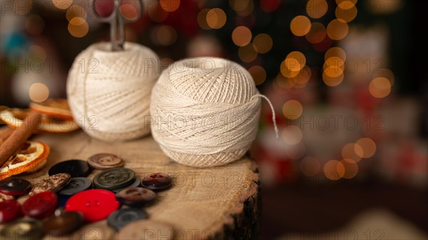 A Christmas scene with beautiful bokeh in the background and sewing tools. In studio