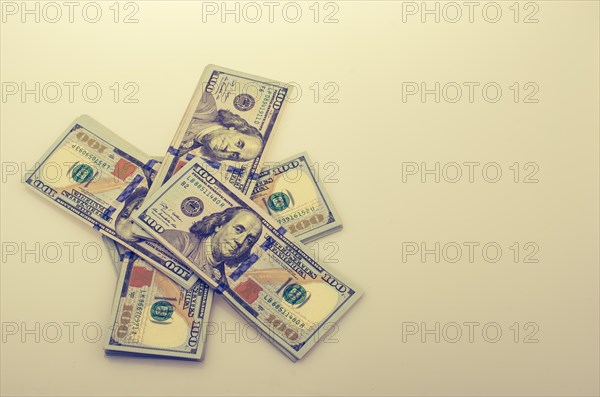 American 100 dollar banknote bundles placed on white background