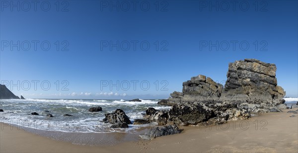 Rocky coast and sandy beach at Praia da Adraga