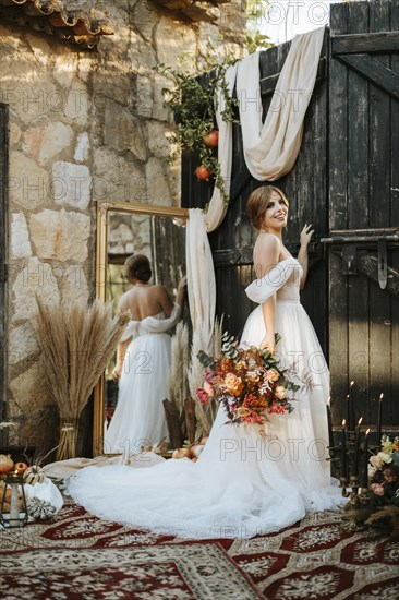 Beautiful bride in rustic arrangement