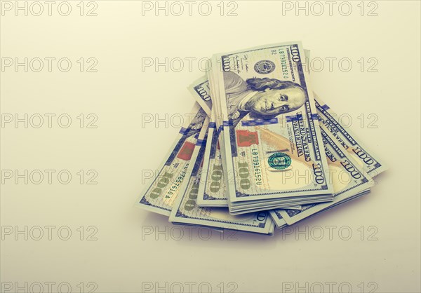 American 100 dollar banknote bundles placed on white background