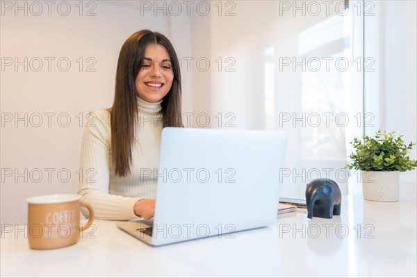 Businesswoman working with a computer smiling