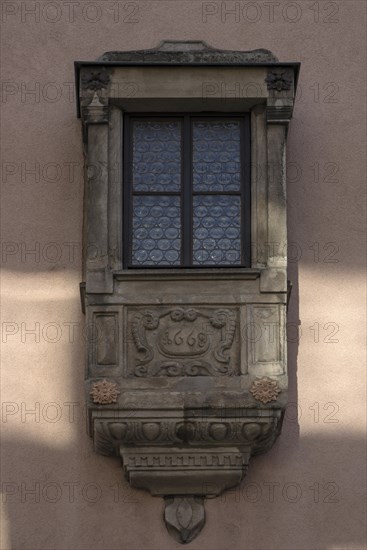Historic sandstone oriel from 1668