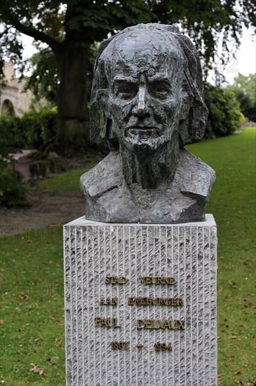 Bust of the surrealist painter Paul Delvaux in city park at Veurne