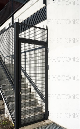 Exterior staircase blocked with fence