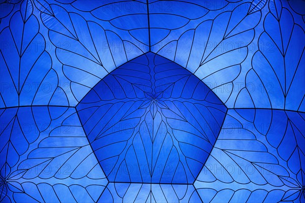 Incidence of light through a blue tent dome