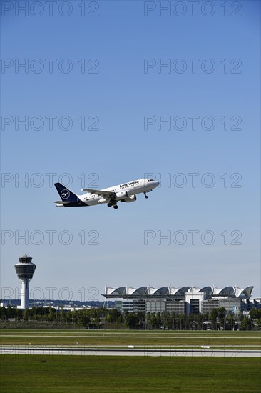 Taking off Lufthansa Airbus A319-112 on runway south with tower