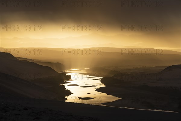 Thunderstorm over the Orange River, also known as the Orange River, on the border between Namibia and South Africa, Oranjemund, Sperrgebiet National Park, also known as Tsau ÇKhaeb National Park, Nam...