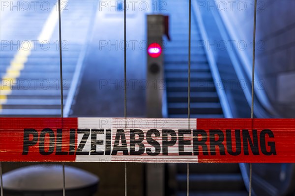 Police cordon. Flutter tape at the main station in front of an escalator, Stuttgart, Baden-Wuerttemberg, Germany, Europe