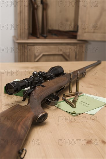 Decorated hunting weapons with ammunition, hunting license and gun ownership card and, Hesse, Germany, Europe