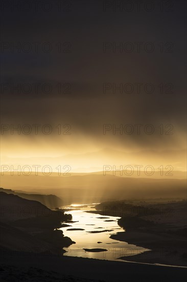 Thunderstorm over the Orange River, also known as the Orange River, on the border between Namibia and South Africa, Oranjemund, Sperrgebiet National Park, also known as Tsau ÇKhaeb National Park, Nam...