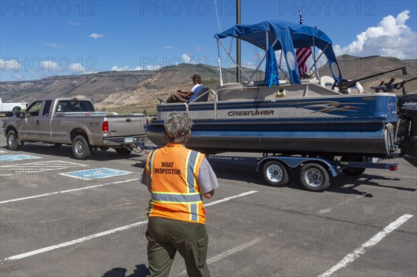Gunnison, Colorado, Carol Soell, a boat inspector at Curecanti National Recreation Area, checks boats entering and leaving Blue Mesa Reservoir for invasive species. Colorados mandatory inspection prog...