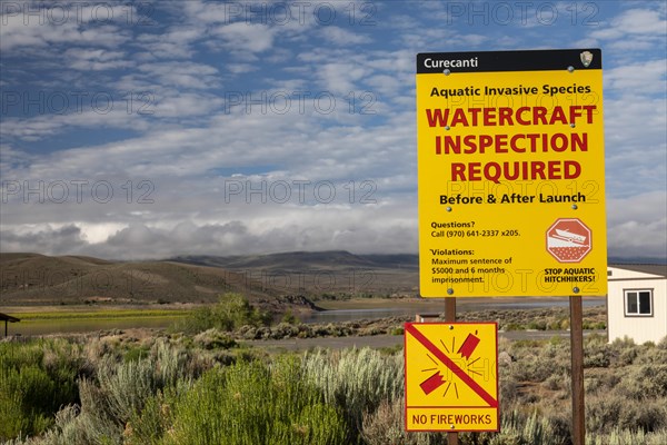 Gunnison, Colorado, A sign at Curecanti National Recreation Area warns boaters that inspections for invasive species are required at Blue Mesa Reservoir. Colorados inspection program aims to keep zebr...