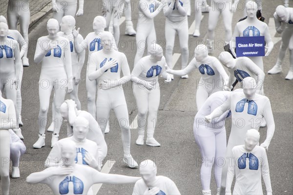 Protest of the environmental organisation Greenpeace, on the Bundesstrasse 14 40 activists demand better air quality, the Neckartor is considered the most polluted street in Germany with high levels o...