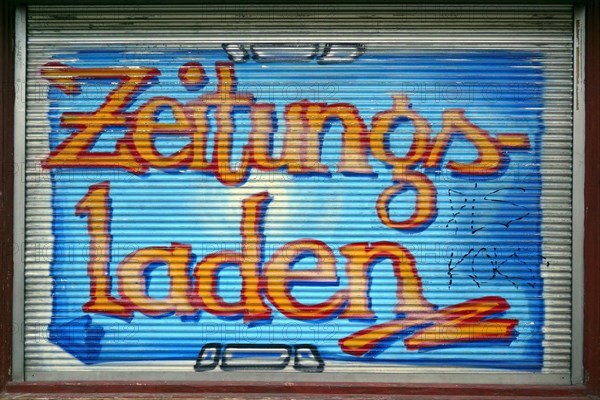 Colourfully painted blind of a shop window at a newspaper shop, Kreuzberg, Berlin, Germany, Europe