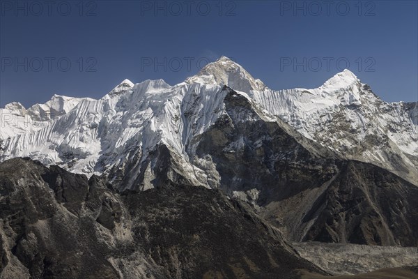 View from Chukhung Ri, a trekking peak located in the upper part of the Imja Khola valley. Imja Tse, known as Island Peak, the popular 6000-metres-plus peak, is just ahead. Makalu, the worlds sixth-hi...