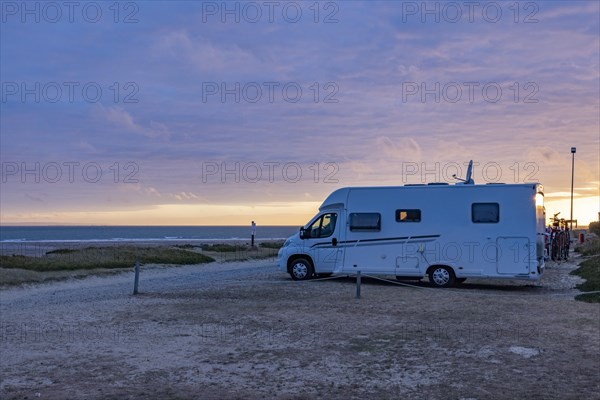 Motorhome at sunset on a motorhome pitch by the sea, Portbail, Normandy, France, Europe