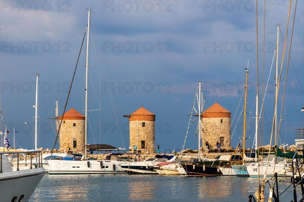 Three windmills on the pier, Mandraki Harbour, Rhodes Town, Greece, Europe